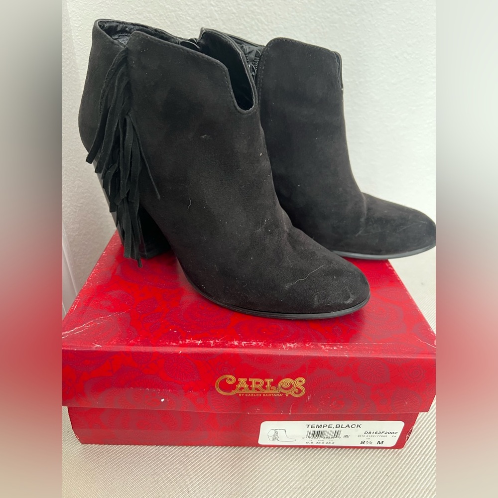 Black leather ankle booties with fringes